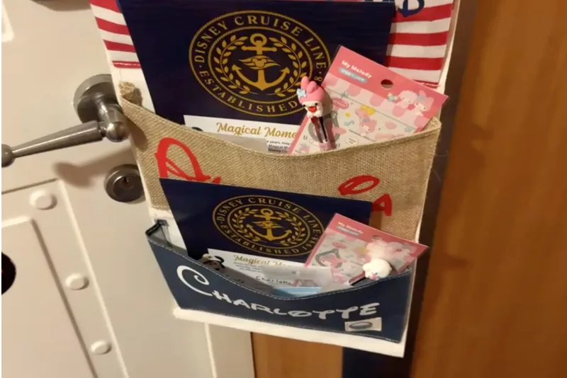 Hanging fish extender pouch with name cards on our door