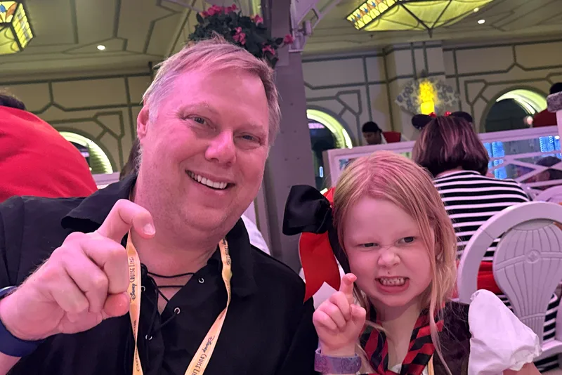 Dad and daughter dressed up at dinner on Pirate Night