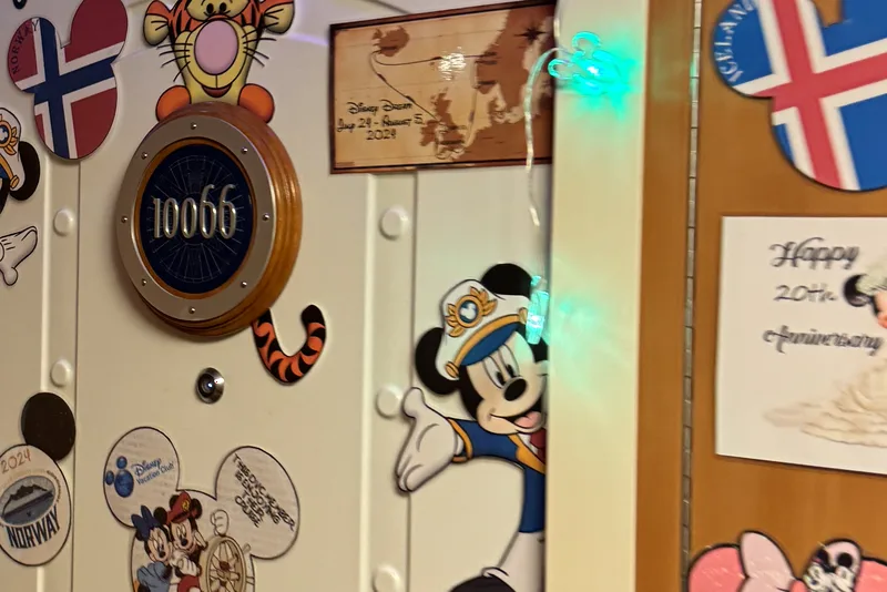 Character magnets around a porthole number plaque