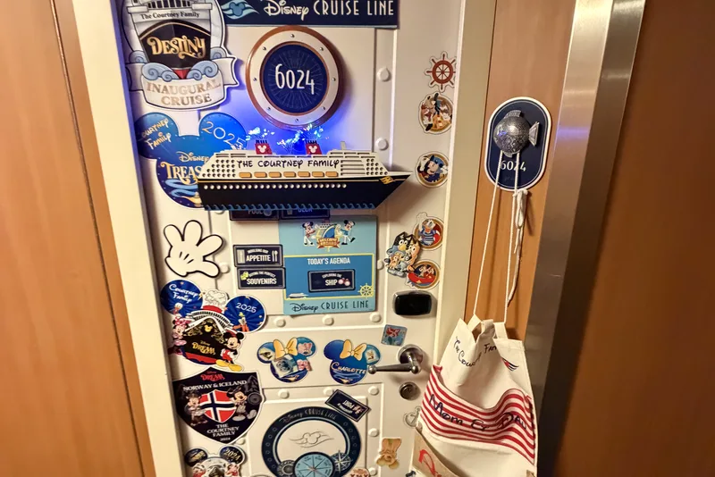 Stateroom door covered in ship and family magnets