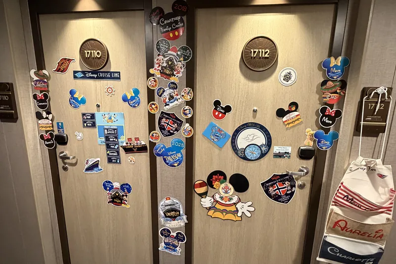 Two decorated cruise cabin doors covered in magnets